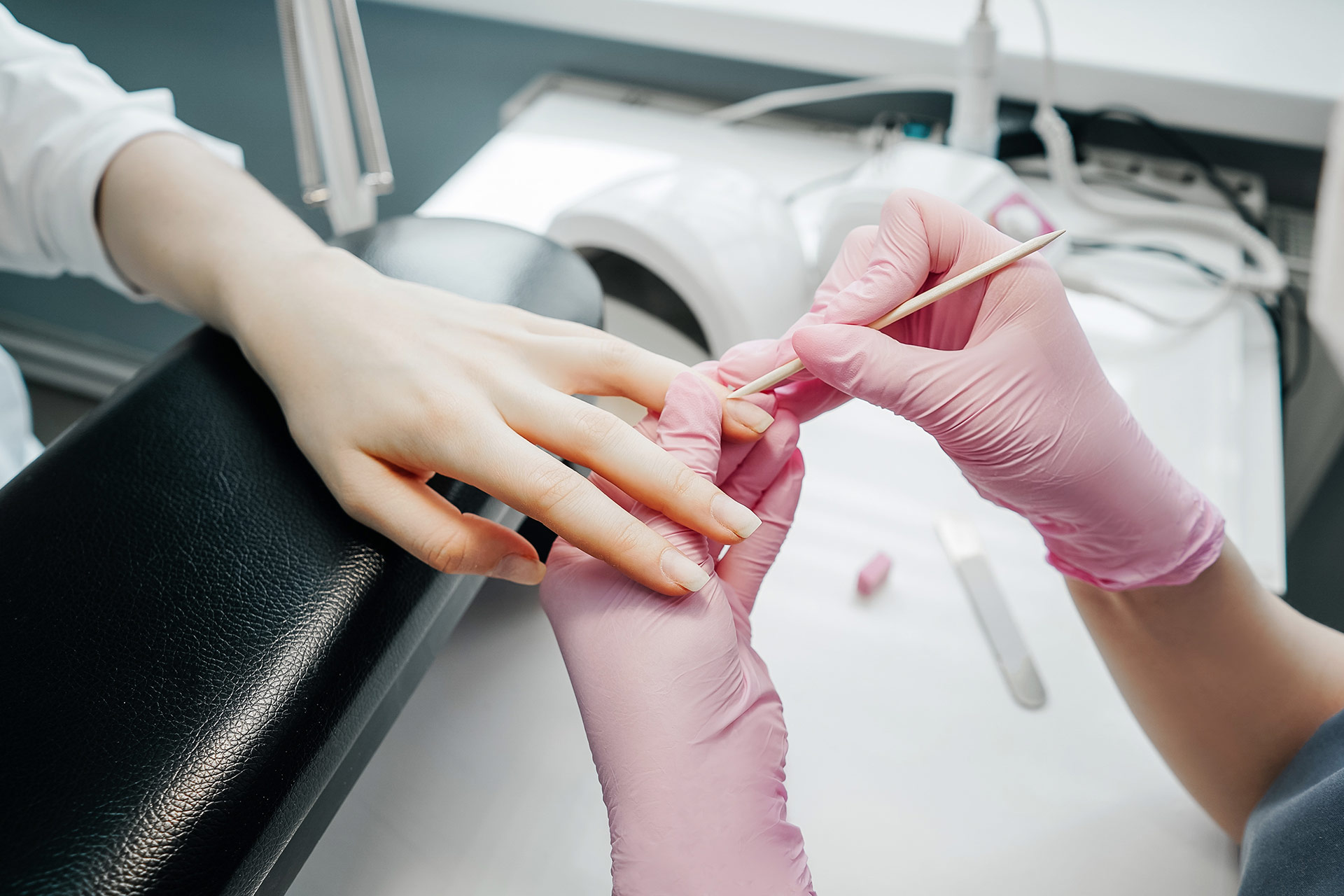 Young woman getting manicure in beauty salon